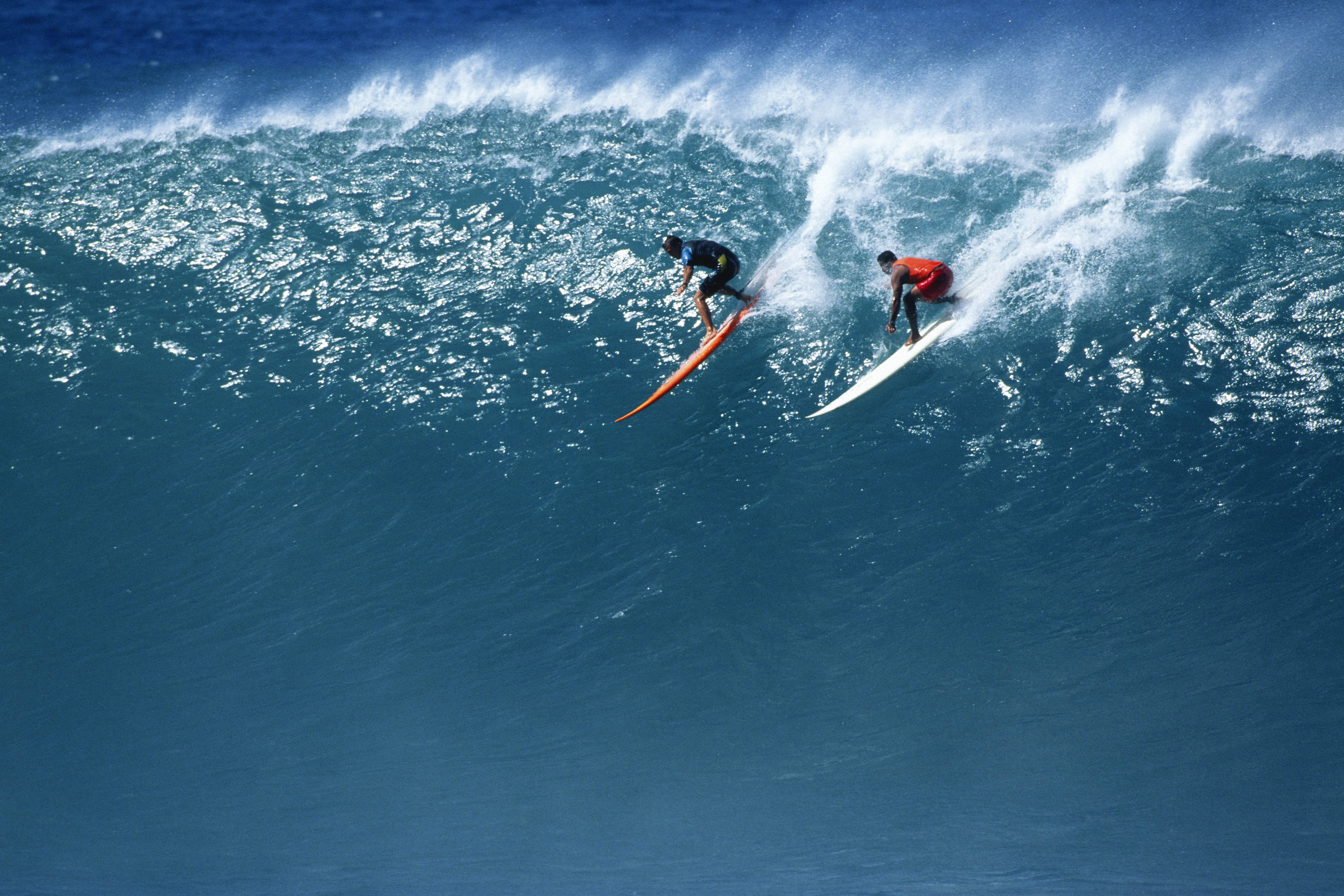 Two Surfers Riding a Huge Wave