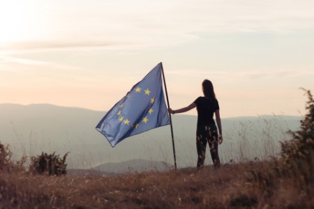 Woman holding European Union flag
