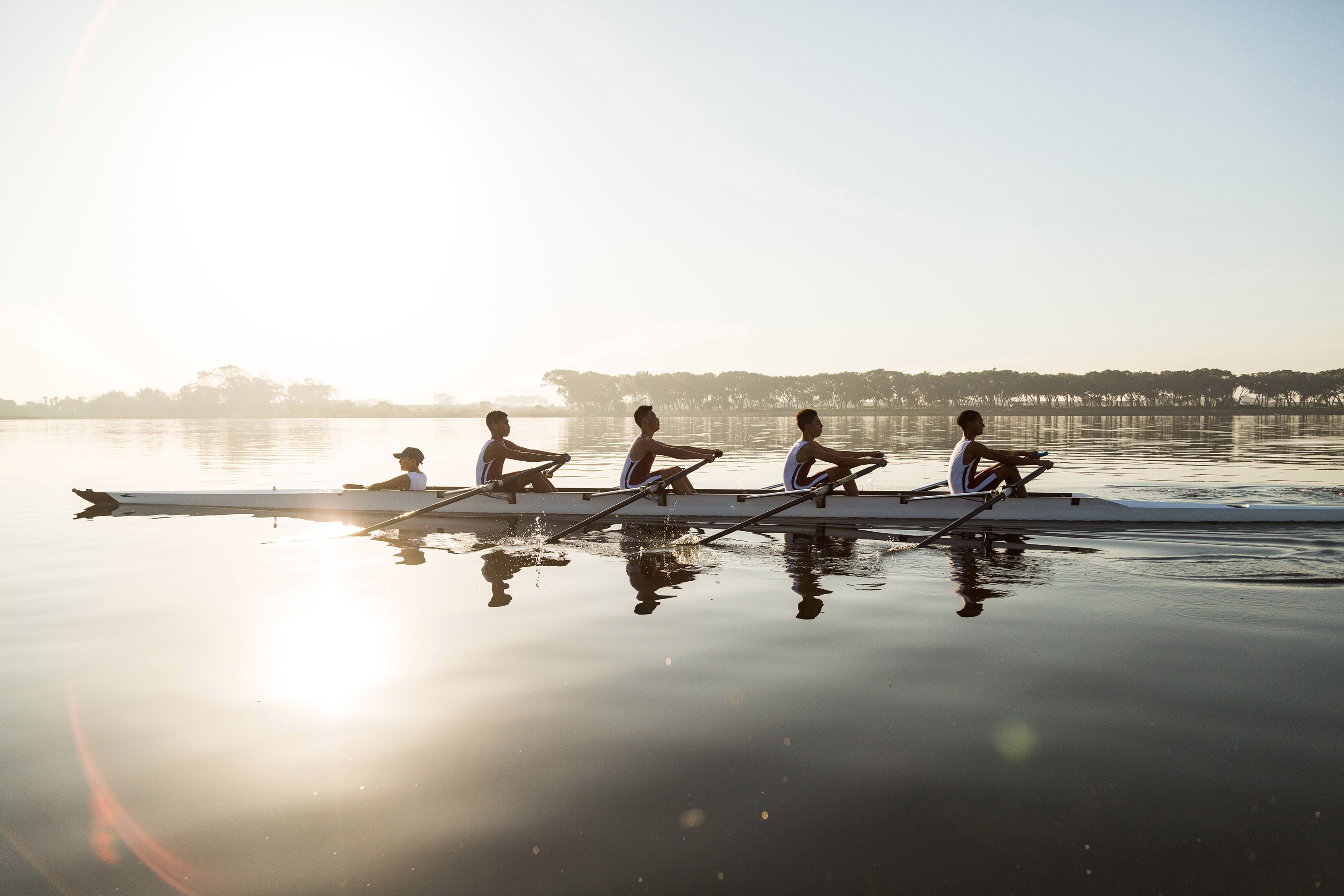 Rowing team on water