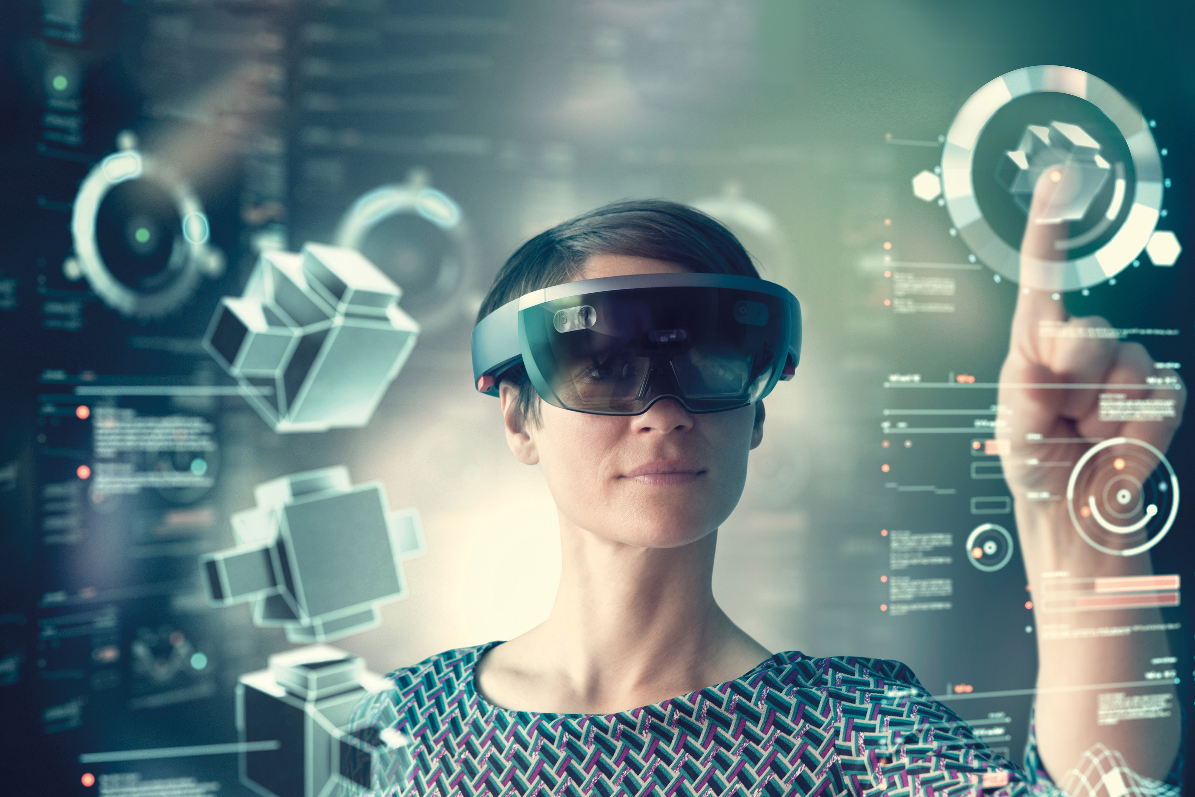 Woman wearing mixed reality smartglasses touching transparent screen