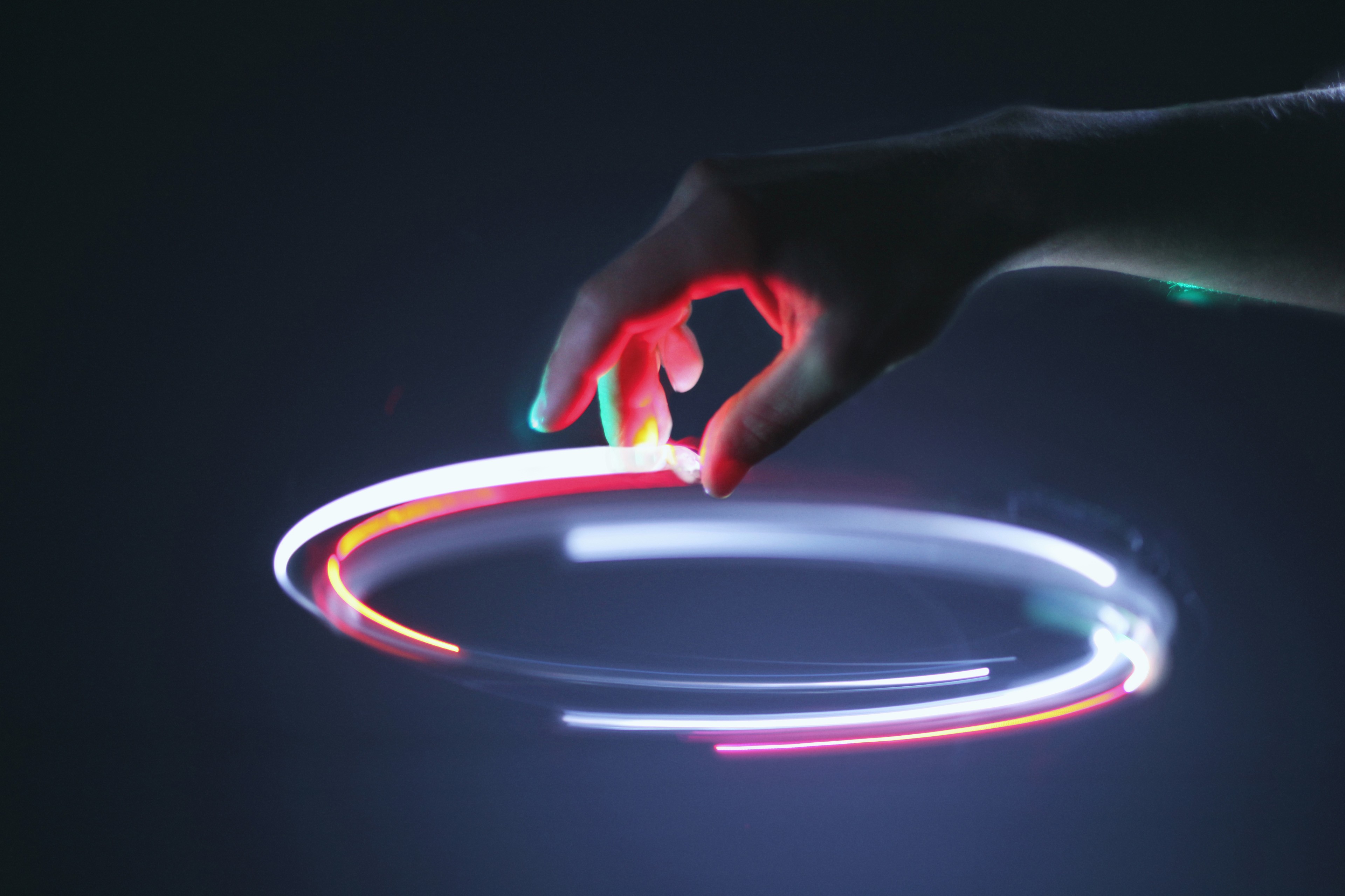 Hand controling light circle in air 