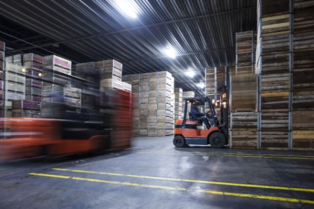 Man on forklift in factory hall