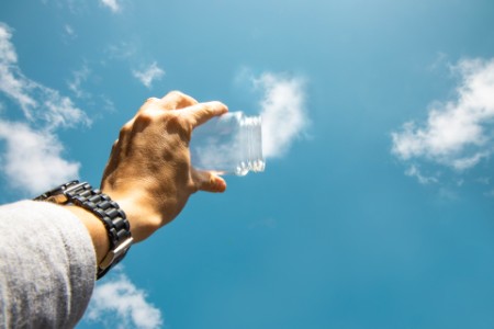 Capturing the clouds from the sky with with glass jar
