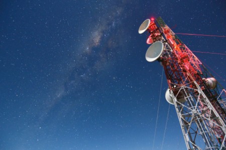 milky way over communication tower