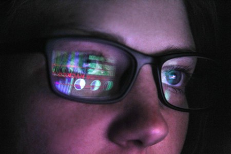 computer screen reflected in eyeglass lens