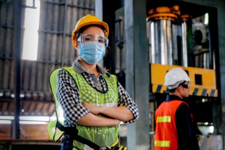 EY - Factory technician with mask on