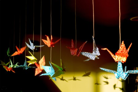 EY - Origami birds hanging by threads