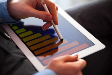 EY - Stock graphs on tablet