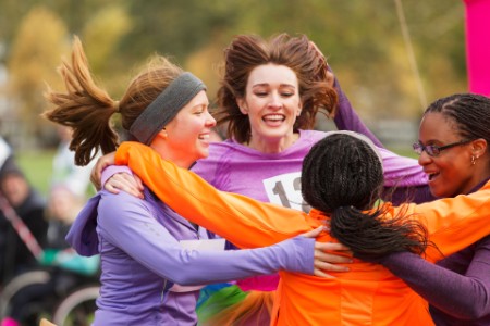 EY - Women celebrating after running race