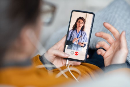 Patient consulting with doctor through video call