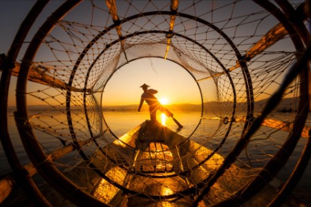 A fisherman at sunset on Inle Lake