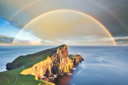 double rainbow arches over the cliff
