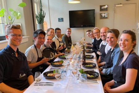 Photo of chiara and colleagues have team meal