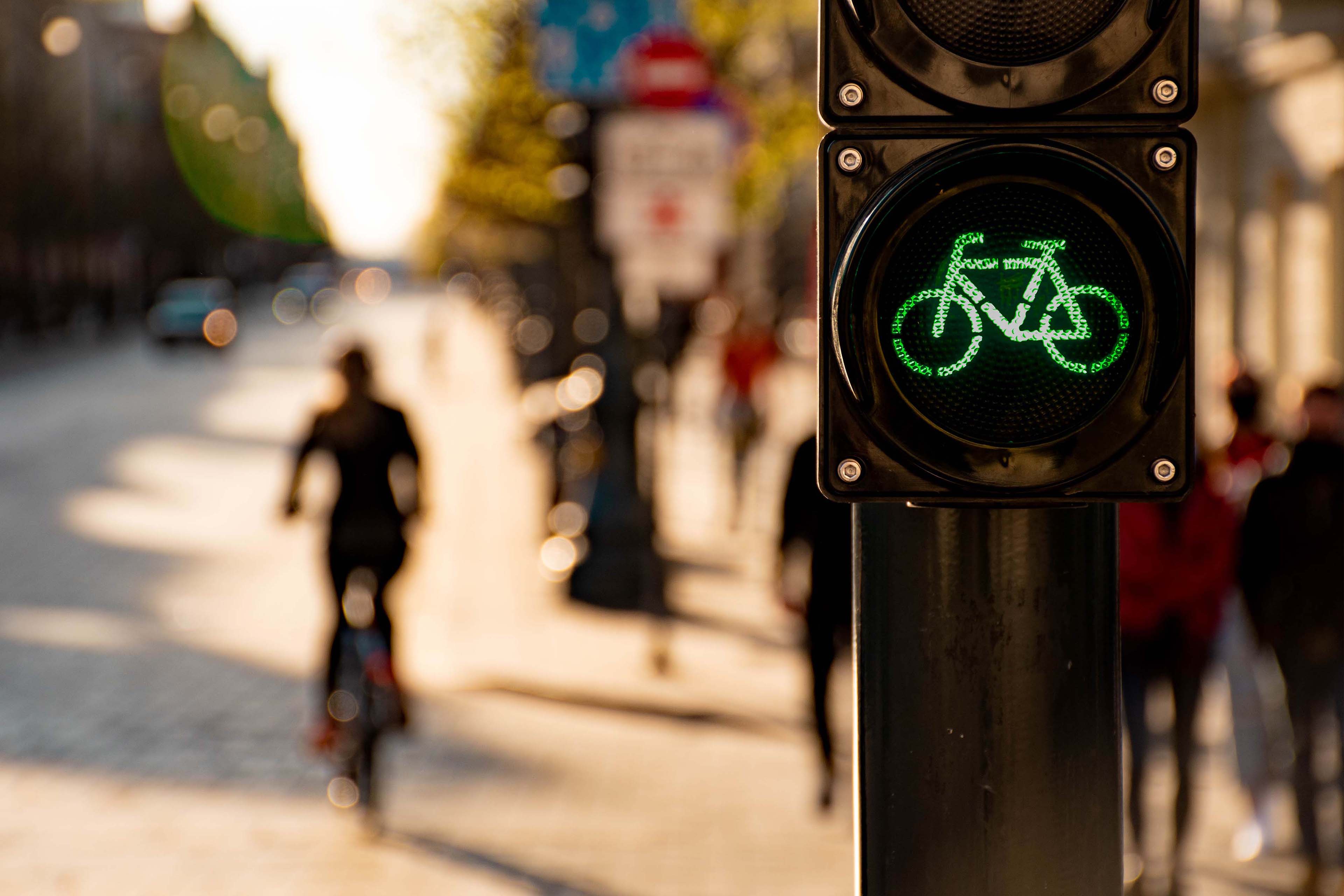 Green traffic light with cyclist