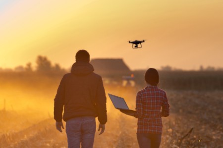  Farmers with drone on field