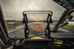 Airplane runway sky through wet windshield