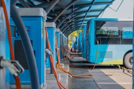 Electric buses charging in station
