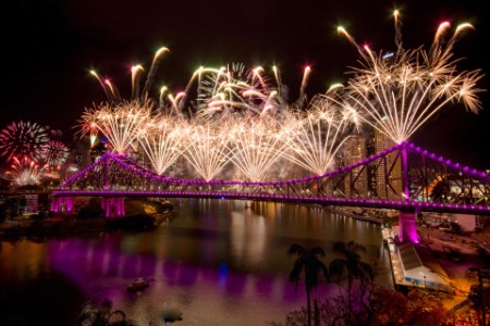 Firework Display Over River At Night