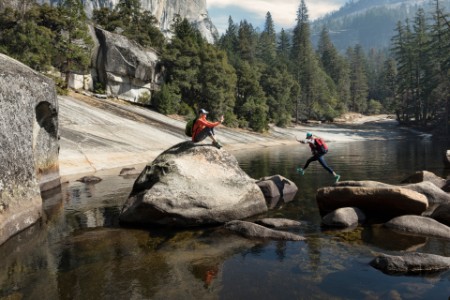 Mother photographing daughter by emerald pool above vernal falls yosemite