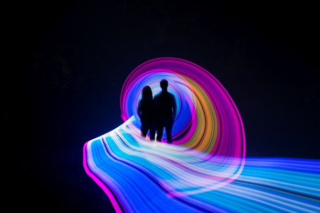  Two people standing in the center of a light painting