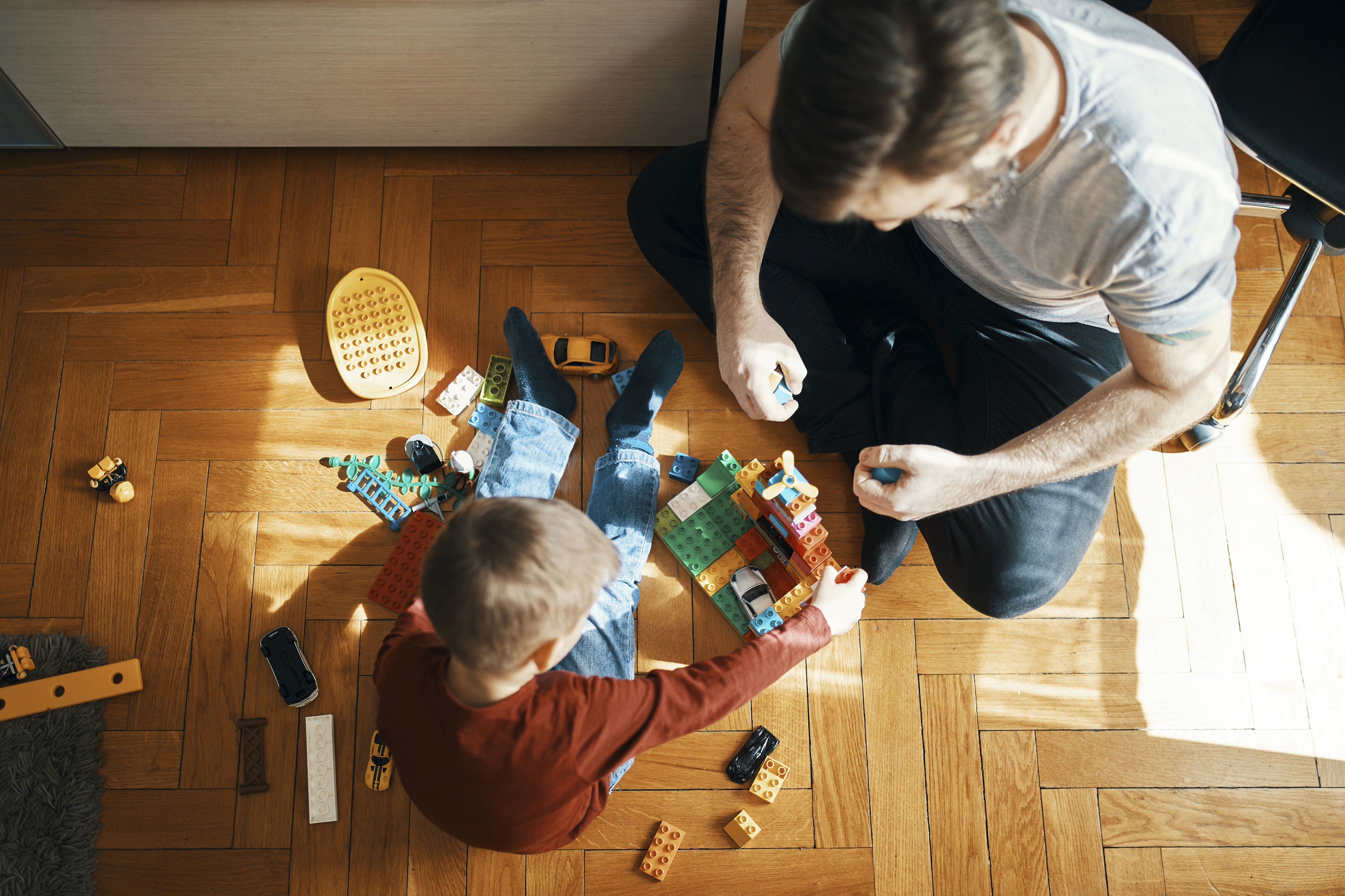 Father and son playing with building blocks