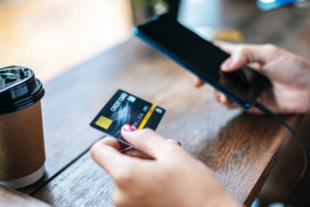 Payment for goods by credit card via smartphone.