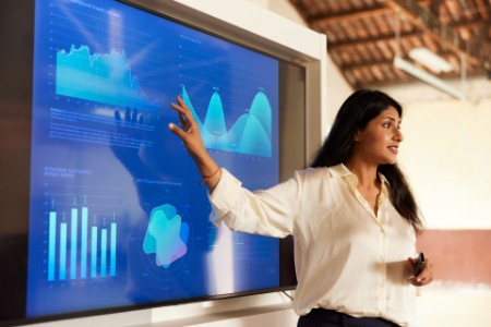 A businesswoman sharing charts in a presentation speech