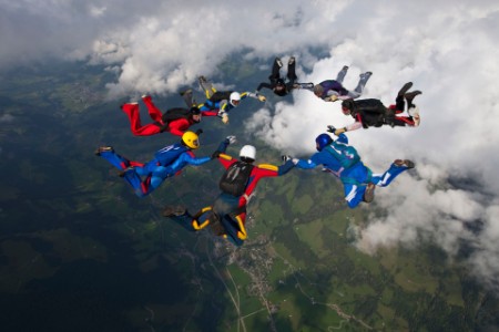 A photograph of sky divers free-falling together.