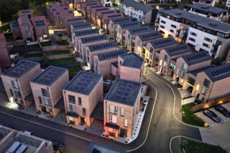 aeria view of a newly built housing development with solar panels installed on the rooftops