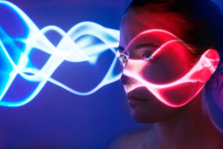 Woman with lights on face blue
