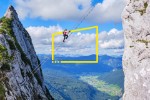 female climber ascends via ferrata donnerkogel intersport in the austrian alps meta data image