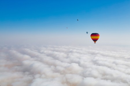 Hot air balloons in fog over Dubai