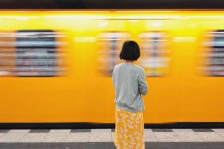 Female in front of train