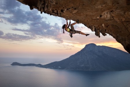 young female rock climber at sunset kalymnos island greece