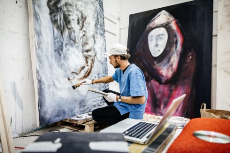 Artist working on painting studio