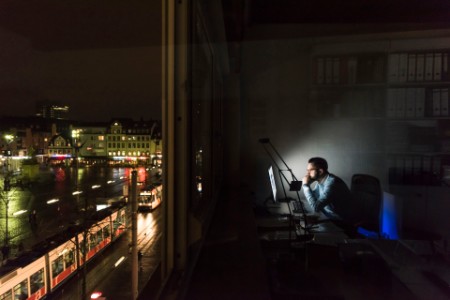 Businessman working on computer in office at night