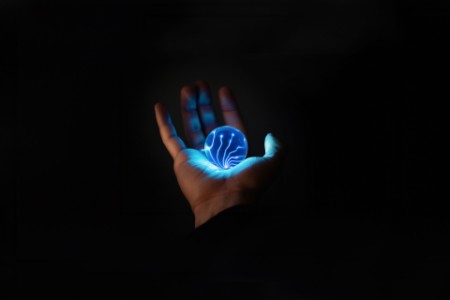 Hand holding electric orb
