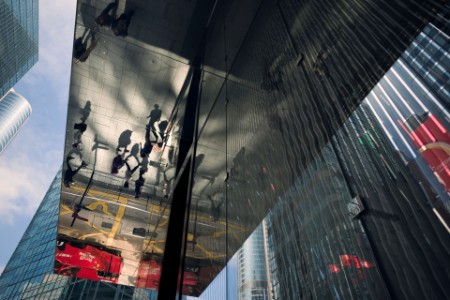 Abstract composition of office facades and reflection of people