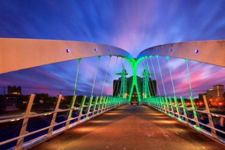 Photo of the Millenium Bridge at Salford Quays in Manchester, England at twilight blue hour