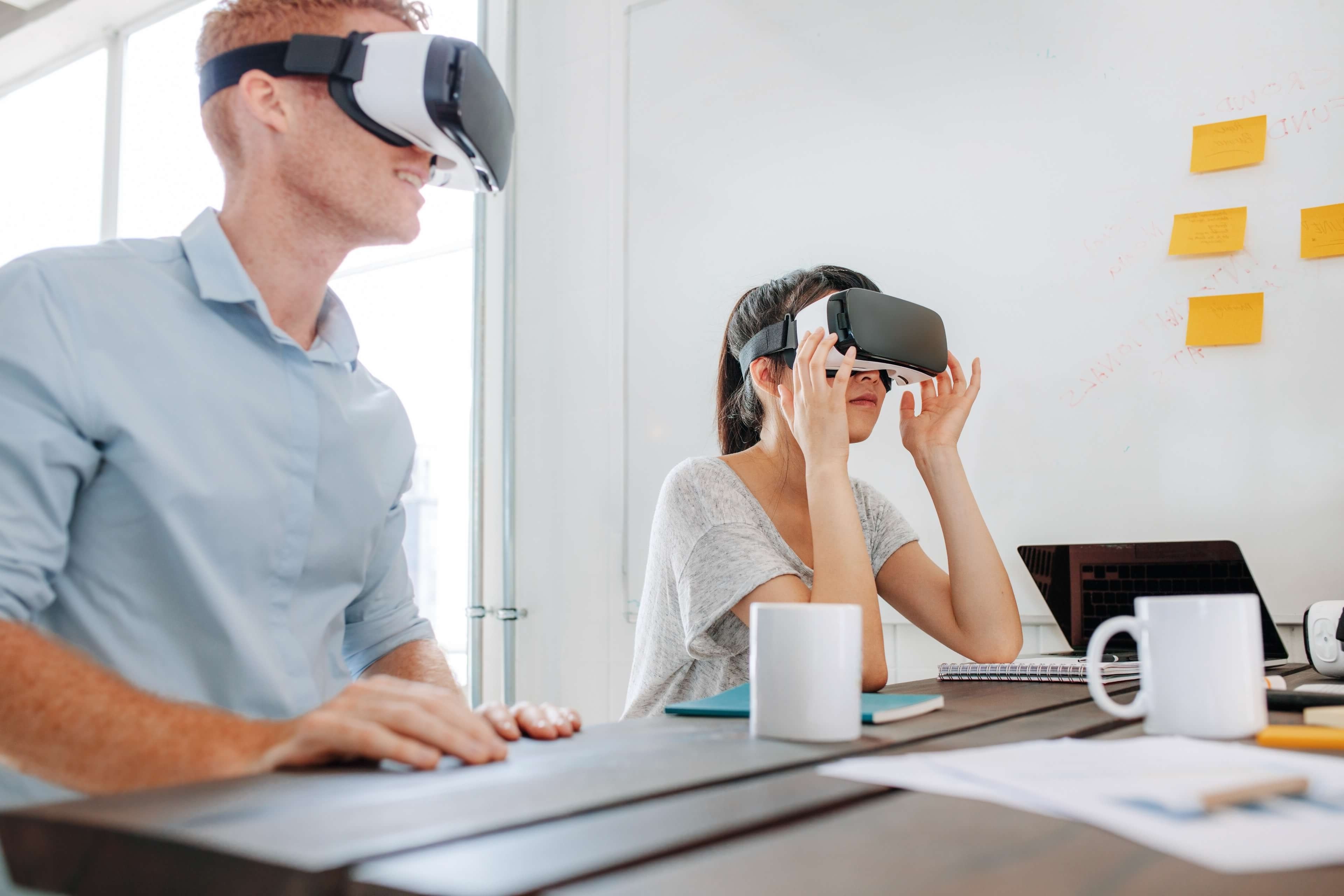 A man and woman using virtual reality headsets        
