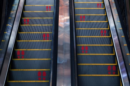High angle view of distance markers on escalators