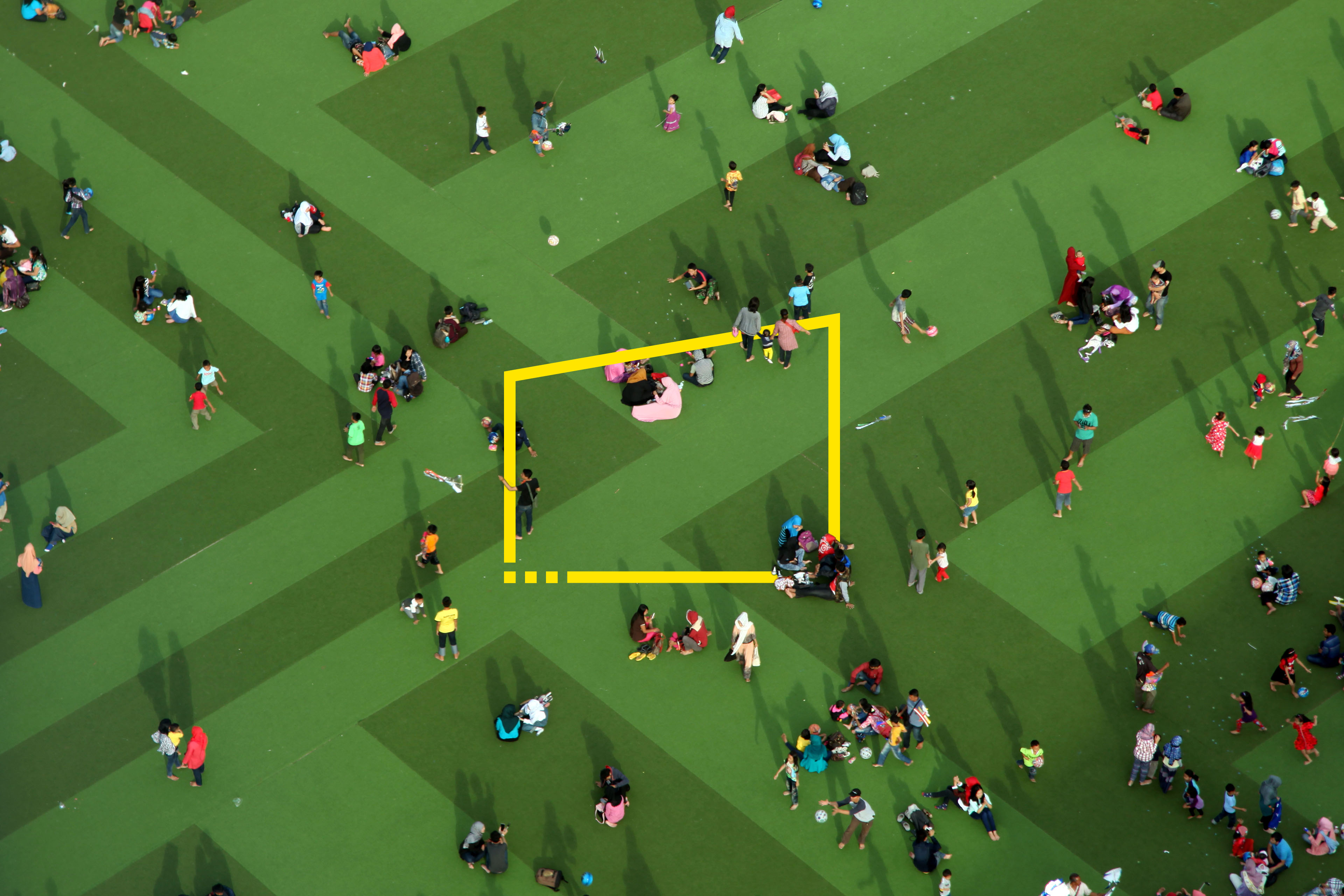 High angle view of families on green lawn
