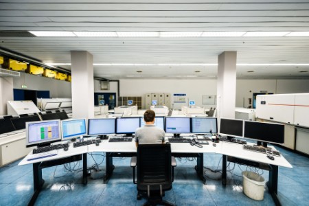 Engineer in a modern and clean control room