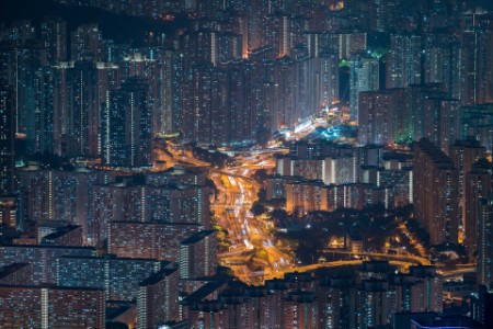 The buildings in hong kong at night as seen from lions head