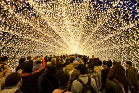 view of people in a tunnel of lights