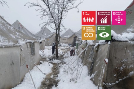 Winter scene showing tents in a refugee camp