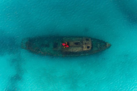 red kayak floating above a shipwreck Carlisle Bay Barbados