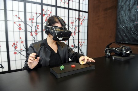 Customer eating sushi with VR headset on