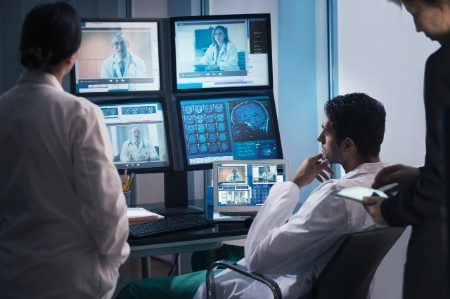 doctors examining x rays in video conference