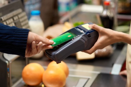 Debit card on reader paying contactless